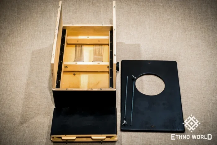 Foldable percussion drum with snare adjustment and castanet in a wooden body, handmade, view from all sides (disassembled and assembled cajon)