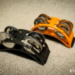 Spider percussion tambourine with foot mounting