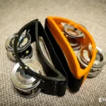 Spider percussion tambourine with foot mounting
