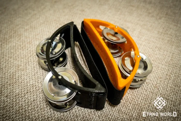Spider percussion tambourine with foot mounting