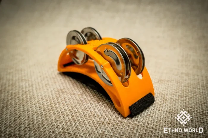 Spider percussion tambourine with foot mounting