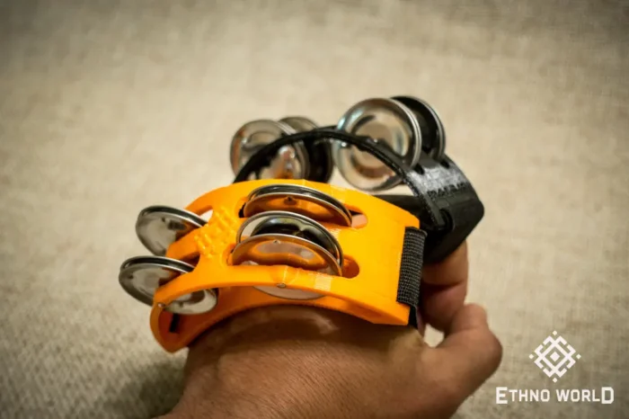 Spider percussion tambourine with foot mounting