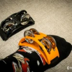 Spider percussion tambourine with foot mounting
