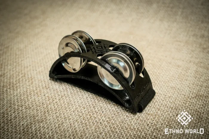 Spider percussion tambourine with foot mounting