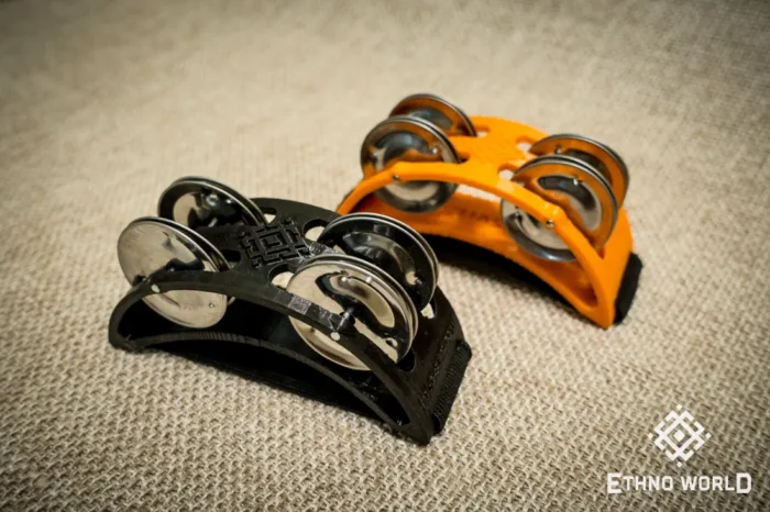 Spider percussion tambourine with foot mounting