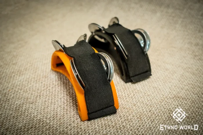 Spider percussion tambourine with foot mounting