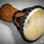 Sun 12″ Djembe – a handmade ethnic percussion drum made of wood with key-tuned leather membrane tension.