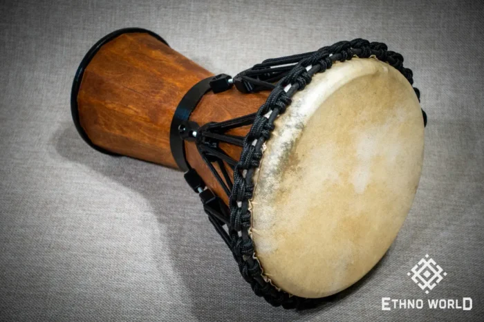 Sun 12″ Djembe – a handmade ethnic percussion drum made of wood with key-tuned leather membrane tension.