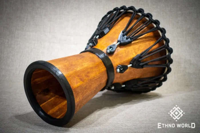 Sun 12″ Djembe – a handmade ethnic percussion drum made of wood with key-tuned leather membrane tension.