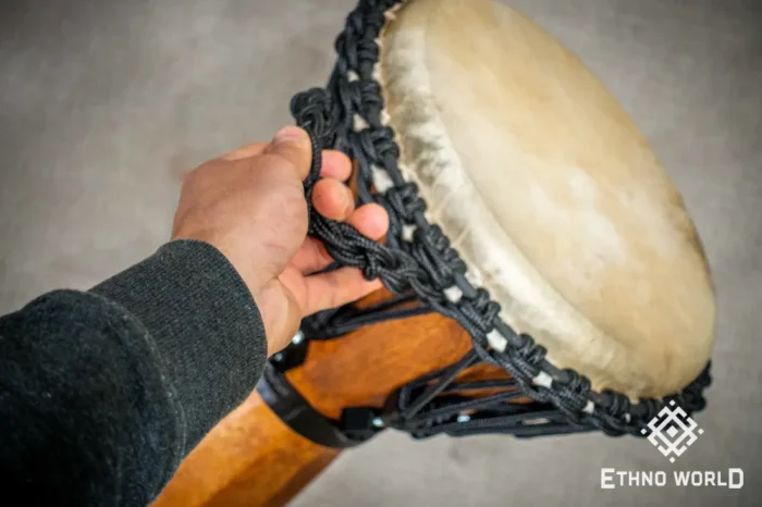 Sun 12″ Djembe – a handmade ethnic percussion drum made of wood with key-tuned leather membrane tension.