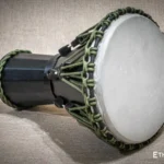 Sun 12″ Djembe – a handmade ethnic percussion drum made of wood with key-tuned leather membrane tension.