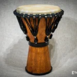Sun 12″ Djembe – a handmade ethnic percussion drum made of wood with key-tuned leather membrane tension.