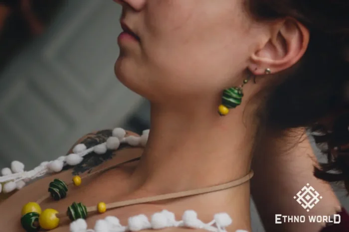 Model wearing handmade green bead necklace