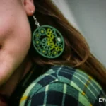 Model wearing handmade green round earrings