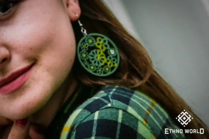 Model wearing handmade green round earrings