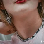 Model wearing handmade silver earrings