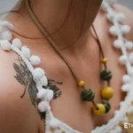 Model wearing handmade green bead necklace