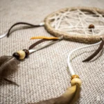 Small dreamcatcher with natural feathers, macrame weaving and wood bead accents, ethnic wall hanging, Ethno World