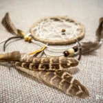 Small handmade dreamcatcher with feathers and wooden beads, hand-woven web, boho wall decor, Ethno World