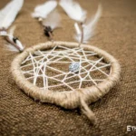 Small handmade dreamcatcher with feathers and wooden beads, hand-woven web, boho wall decor, Ethno World