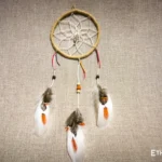 Small handwoven dreamcatcher with feather and bead details, tribal boho wall decoration, Ethno World