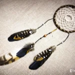 Medium handmade dreamcatcher with feathers and wooden beads, hand-woven web pattern, boho wall decor, Ethno World