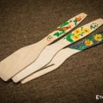 Fan of hand-painted wooden spatulas, traditional Petrykivka floral design, Ethno World