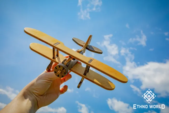 Handmade wooden airplane toy, detail view