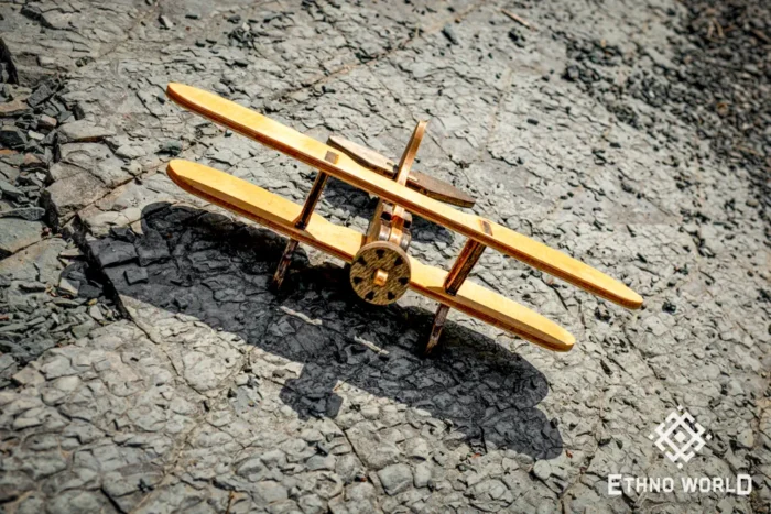 Handcrafted wooden biplane model close-up