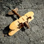 Wooden airplane toy, assembled model, side view