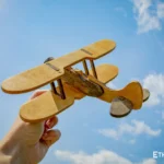 Handcrafted wooden biplane model close-up