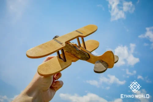 Handcrafted wooden biplane model close-up
