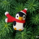 Needle felted penguin toy with Santa hat, handmade wool