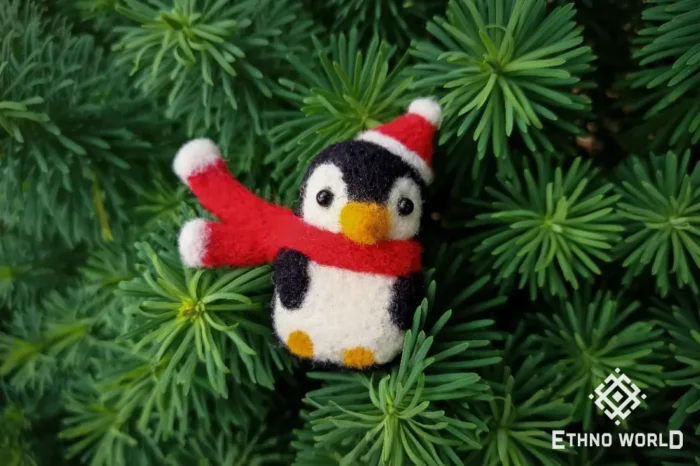 Needle felted penguin toy with Santa hat, handmade wool