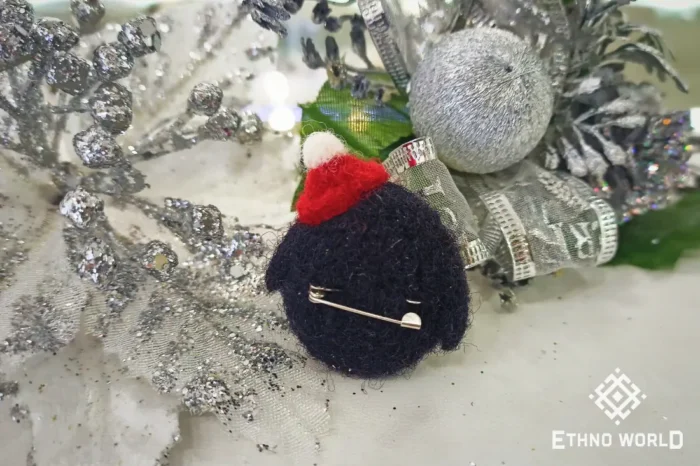 Needle felted penguin brooch with pine branches, handmade wool